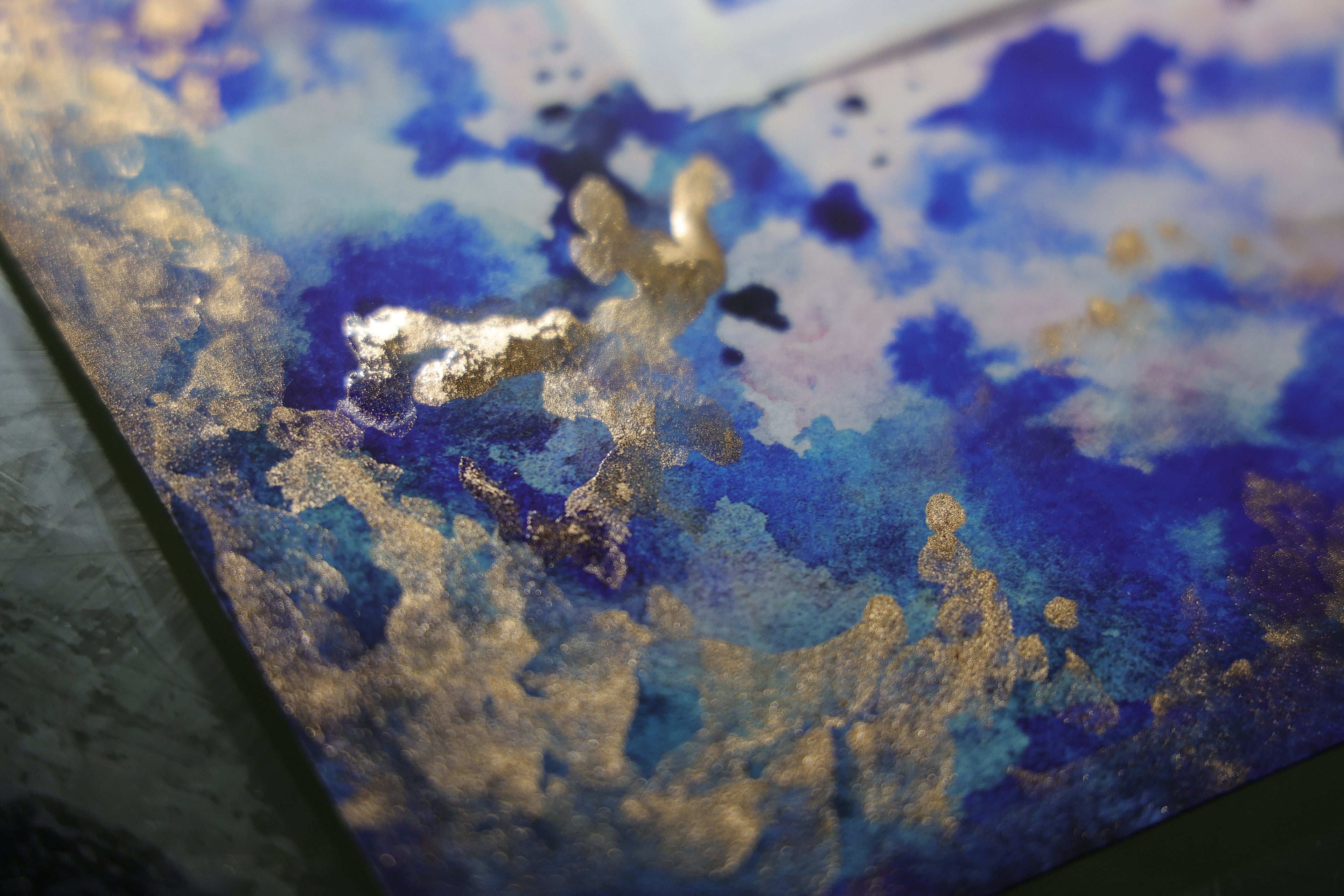 Gold 24K hand painting process on a Ketubah "Sunset on Tallith"