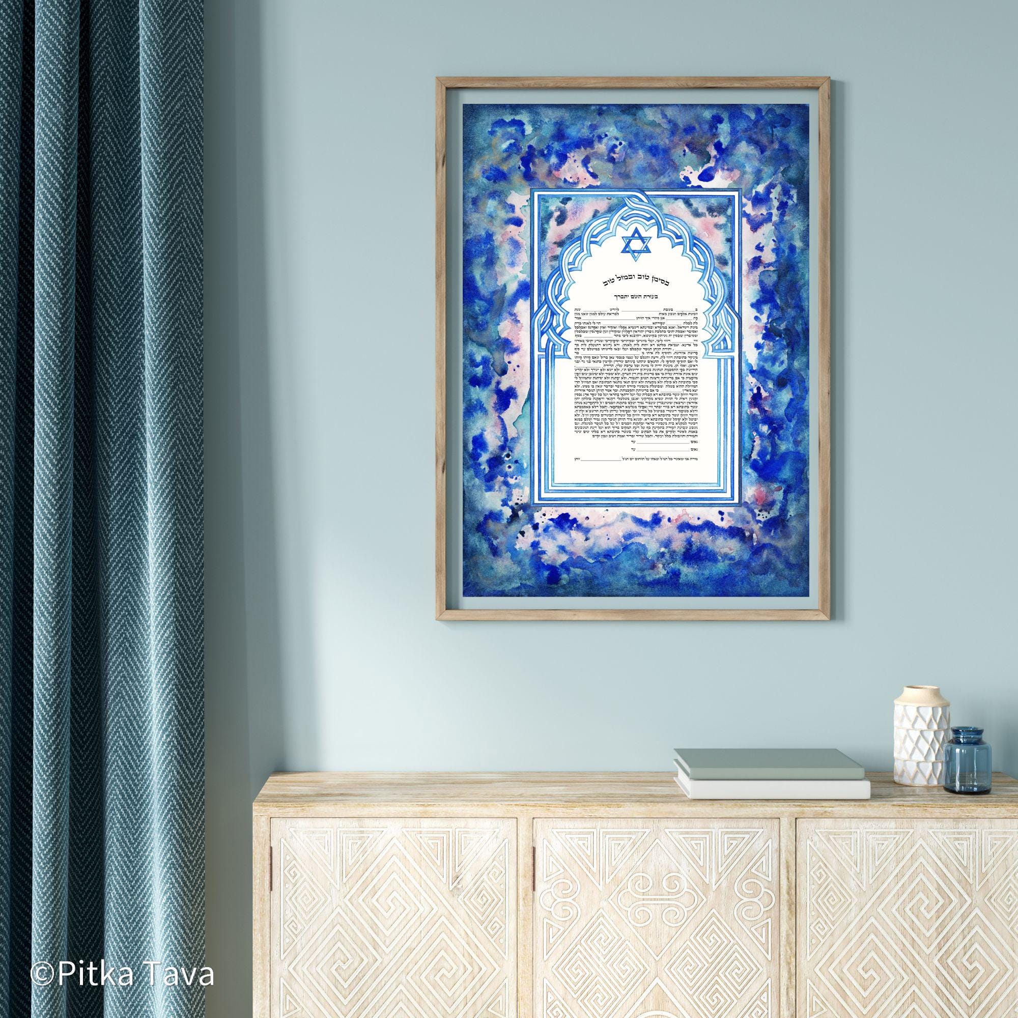Jewish ketubah handmade for chuppah jewish wedding maroccan style with blue and white magen David colors like the Talith. Watercolor painting handmade ketubbah with sunset colors in maroccan style, unique one of a kind wedding ketubbah piece of jewish art made in israel by designer ketubbah. Illustrated blue, pink and white ketubah with sunset colors and blue and white colors around the text to remember blue colors of Am Israel.