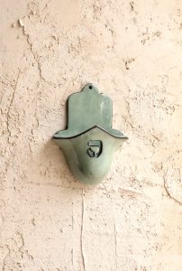 חמסה מחזיק נר בצבע ירוק פסטל